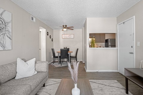a living room and dining room with a couch and a table